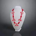 Red Beaded Necklace With Floral Cross Design On White Mannequin