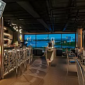 Modern Bar Interior With Large Windows Scenic View Bar Stools And Liquor Racks