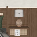 Warm Light Table Lamp With Terracotta Jar Base And White Lampshade On Bedroom Nightstand