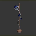 Decorative Indoor Plant With Blue Leaves And Brown Curved Stem In Terracotta Pot