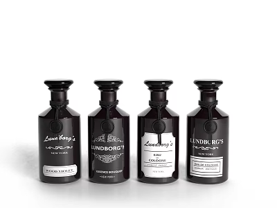 Elegant Perfume Cosmetics Collection With Four Black Glass Bottles And Brand Labels 3d model