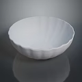 Artistic White Sculpture Bowl Carved With Wavy Edges And Smooth Reflective Surface