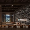 Hotel Public Lounge Area With Wooden Ceiling Stone Wall And Mountain View Through Large Windows