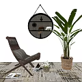 Comfortable Lounge Chair In Room With Potted Plant Round Mirror And Magazines On Rug