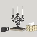 Elegant Black Candelabra With Three Purple Candles On Book And White Spherical Tissue Box