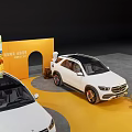Automotive Exhibition Display With White Cars Orange Backdrop And Decorative Fruits