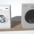 White Front Load Washing Machine And Dryer In Home Laundry Space
