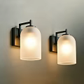 Two Modern Wall Sconces With White Shades And Warm Light For Home Decor