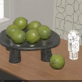 Fresh Green Limes Arranged On Black Stone Tray With Glass Cup And Geometric Wall Art