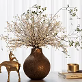 Copper Round Vase With White Floral Branches And Golden Horse Statue Beside Books And Candle