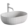 White Oval Vessel Sink with Black Faucet and Metallic Decorative Balls