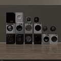 Various Front Loading Washing Machines in Black and White Colors with Different Styles Arranged for