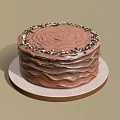 Delicious Chocolate Cake With Ruffled Frosting Topped With Chocolate Sprinkles On Round Plate