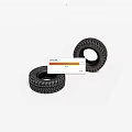 Two Black Automotive Tires with Deep Detailed Tread on White Background