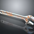 Rusty Metal Wrench Tool With Corrosion Details On Reflective Surface
