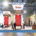 Orthoworks Exhibition Booth Featuring Red Structure White Canopy Multiple Columns And Visitors