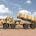 Camouflage Multi Wheeled Military Functional Vehicle With Missile Launchers On Desert Terrain