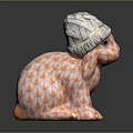 Ceramic Rabbit Figurine Wearing Patterned Hat With Orange White Fish Scale Design And Golden Paws 3d model