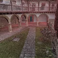 Historic Building Courtyard With Arched Arcades Stone Columns Flagstone Path Lawn And Green Plants