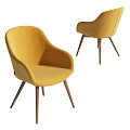 Yellow Upholstered Dining Chairs With Curved Back And Wooden Tapered Legs