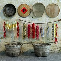 Rustic Garden Decor With Woven Plates Hanging Corn Chili Fish And Baskets On Vintage Wall