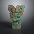 Ancient Bronze Beast Mask Sculpture Carving Featuring Symmetric Patterns And Greenish Patina