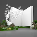 Floral Art Installation With Open White Book Sculpture Tree Decoration Green Plants Rocks And Moss