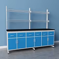 Functional Work Desk With Blue Cabinets Black Countertop And Metal Shelves