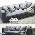 Gray Upholstered Three Seater Sofa With Pillows Blanket And Side Table On Rug 3d model