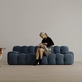 Woman Sitting On Tufted Blue Sofa Holding Baby With Dog Beside