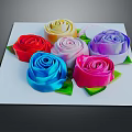 Colorful Decorative Ornament Set with Six Rose Shaped Ornaments Various Colors Green Leaves on White Square Base