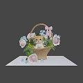 Cute Kitten Sitting In Wicker Basket With Roses Blue Flowers And Pink Bow On Table