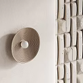 Modern Textured Wall Design With Arched Stone Brick And Circular Lighting Fixtures
