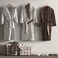 Soft Bathrobes Hanging On Wall With Storage Baskets Towels And Slippers