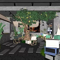 Cozy Café Interior Design With Large Tree Green Plants And Concrete Walls