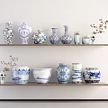 Blue and White Patterned Ceramic Vessels on Wooden Shelves with Dried Branches and Skull Decor