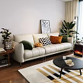 Beige Three Seater Sofa With Colorful Patterned Cushions Abstract Painting And Green Plants