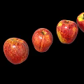 Fresh Red Apples With Yellow Speckles Arranged In A Row On Black Background