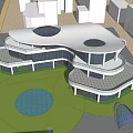 Modern Architectural Exterior Of Multi Level Building With Glass Facade Lawn And Circular Pond