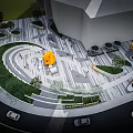 Modern Urban Plaza Design With Circular Layout Yellow Sculpture Lawn Areas And Pedestrians