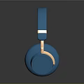 Blue Over Ear Headphones With Gold Accents Computer Accessory On Black Surface With Reflection