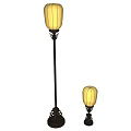 Two Different Sizes Floor Lamps With Yellow Lampshades And Dark Decorative Bases