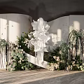 Elegant Banquet Hall Interior Design With Large White Floral Decor And Green Plants