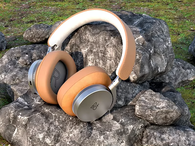 Tan And White Over Ear Headphones With Soft Leather Cups Placed On Natural Stone Surface 3d model