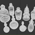 Assorted Glass Bottles With Decorative Designs In Transparent Red And Pink