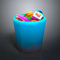 Blue Trash Can Filled With Various Waste Items Like Drink Carton And Plastic