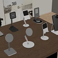 Various Modern Phone Stands With Different Designs On Wooden Table
