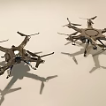 Two Different Drones With Propellers And Metal Frames On White Background