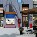 Vibrant Commercial Street with Traditional Chinese Signs Storefronts Awnings Outdoor Seating and Green Plants