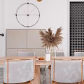 Elegant Restaurant Dining Area With Wooden Oval Table Metal Frame Woven Chairs And Vase Decor